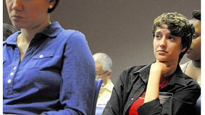 J. Wester, a member of the LGBTQ Advisory Council, listens to panelists during a town hall meeting Wednesday night at the Allegheny County Department of Human Services building, Downtown.