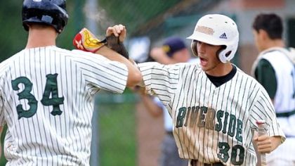 Riverside's Tyler Falk, left, greets Austin Hall after he scores in the fifth inning Monday against North Star in the PIAA Class AA semifinals at Shaler. Riverside won, 6-2 and will play for the state championship Friday.