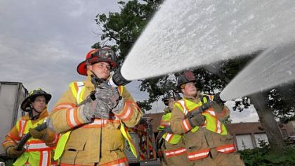 From left, Clairton volunteer firefighters Phil Marra, Jesse Dinkel, William Smoyer and Jesse Fruciano demonstrate using their fire hoses outside their station in Clairton.