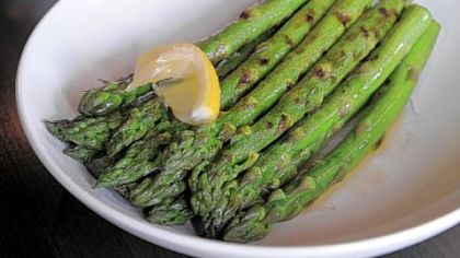 "The best dishes are simple, focusing on a few good ingredients A side of grilled asparagus was perfectly cooked, generously dressed with olive oil and lemon that pooled onto the plate."