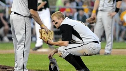 Thomas Jefferson pitcher Greg Schneider turns over the ball to his coach last Thursday at North Allegheny High School.