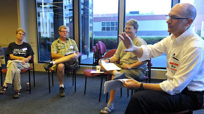 Bob King, right, acting MoveOn Greater Pittsburgh Council Organizer, guides the council's June meeting at the United Steelworkers Building on Thursday evening.