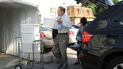Joe Amendola, attorney for Jerry Sandusky, loads boxes onto a cart Thursday after arriving for the fourth day of Mr. Sandusky's trial at the Centre County Courthouse in Bellefonte, Pa.