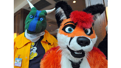 Damin (left)  and Nitro hang out in the Westin lobby as other Furries check in for the Anthrocon 2012 convention on Thursday.
