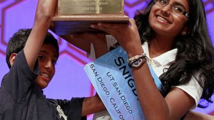 Fourteen-year-old Snigdha Nandipati and her brother Sujan hoist her trophy after she won the National Spelling Bee last month by spelling the word "guetapens," which means "trap" or "snare."