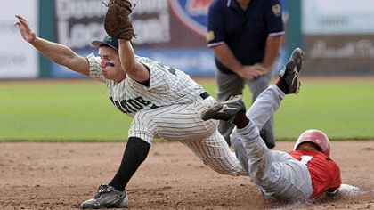 Riverside's Tyler Falk stretches to get Pine Grove's Jim Martin out at first base in the PIAA class AA championship in State College Friday afternoon.