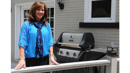 Bellevue recently passed an ordinance banning grilling within 5 feet of a home. Bellevue Councilwoman Kathy Coder opposes the rule. On Friday, she posed by her grill -- which is closer than 5 feet to her home. "I don't know what I'm going to do," she said.