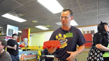 Fernando DeCarvalho, the owner of Fernando's Cafe, Downtown, says the $23,000 check he got will cover rent, electricity, gas and food through July. "I believe God worked through the furries, because I really was in need," he said.