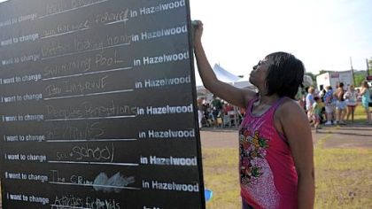 Shawnee Wright, a Hazelwood resident for 11 years, writes out what she wants to change in Hazelwood.