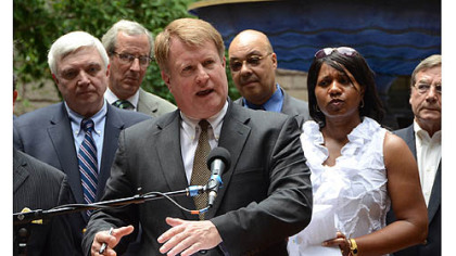 Allegheny County Executive Rich Fitzgerald talks about taking legal action to challenge the voter ID law at a news conference Friday in the courtyard of the Allegheny County Courthouse.