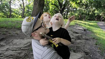 Robert Sayre with Abel, 2, and Margo, 4.