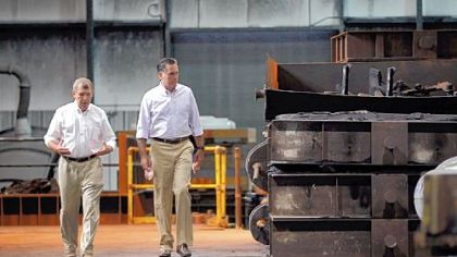 Republican presidential candidate, former Massachusetts Gov. Mitt Romney speaks with Mike Leib, the president of Weatherly Casting Co., as he is given a tour during a campaign stop Saturday in Weatherly, Pa. Mr. Romney continues his campaign swing through battle ground states as he battles President Barack Obama for votes.