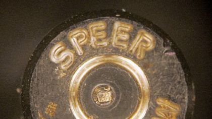 A bullet casing showing identification codes, at center, is shown through a microscope at the Los Angeles Police Academy.