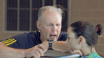 Chartiers Valley's Maria Lohman listens to directions from Pitt diving coach Julian Krug at Trees Hall during a recent practice session.