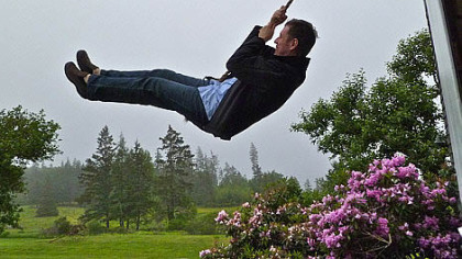 Michael Sims celebrating the publication of his book "The Story of Charlotte's Web" last year by swinging on the rope swing that still hangs in the Maine barn that inspired E.B. White to write his classic children?s book.