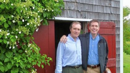 Michael Sims, right, author of "The Story of Charlotte's Web," stands with his editor and publisher, George Gibson, in front of the Maine barn that inspired E.B. White to write his beloved children's classic "Charlotte's Web."