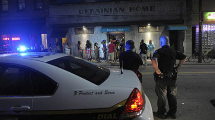 Pittsburgh police officers shut down East Carson Street between 11th and 12th Streets to keep crowds from gathering and blocking traffic outside the Caravan Club after the bars close at 2 a.m. The Caravan Club is the only after-hours club on the South Side.