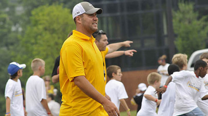 Steelers quarterback Ben Roethlisberger watches youths work out at his football camp.