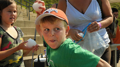 Cooper Courson, 7, winds up to throw a snowball into the Ohio River. He was among the kids participating in the annual Snowball Day at the Carnegie Science Center on the North Shore.