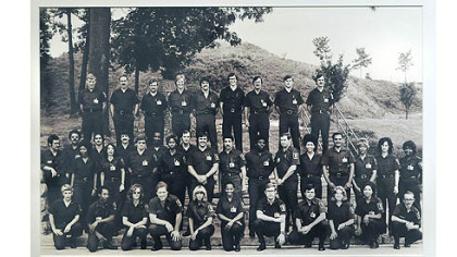 A photograph at August Wilson Center exhibit showing the Allegheny County Police Academy's 1976 cadet class, its first including women.