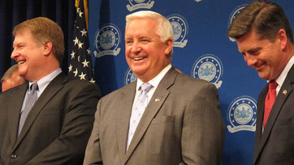 Gov. Tom Corbett, center, with Lt. Gov. Jim Cawley, right, and Allegheny County's executive, Rich Fitzgerald, during a light moment at a Capitol news conference designed to demonstrate a show of support as he seeks legislative approval for a $1.7 billion tax break to lure an integrated petrochemical industry to Pennsylvania on Wednesday in Harrisburg.