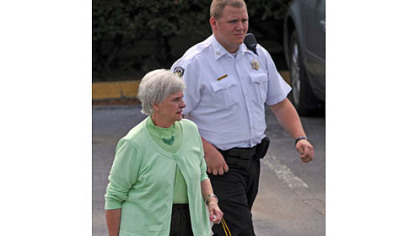 Dottie Sandusky leaves the Centre County Courthouse after testifying on behalf of her husband, Jerry, during his trial Tuesday afternoon.
