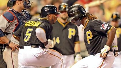 Josh Harrison greets Andrew McCutchen at home after McCutchen hit a two-run home run to put the Pirates ahead, 6-2, in the seventh inning agains the Minnesota Twins Tuesday night at PNC Park.