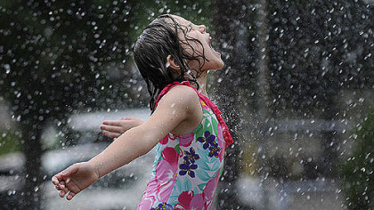 Ella Stewart, 8, of Brookline plays in the Moore Park splash park this morning in Brookline. Her grandmother, Barbara Matrascia, brought seven of her eight grandchildren to the park today. Ms. Matrascia said she liked to bring the kids to the pool when it was open.