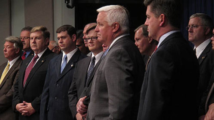 Gov. Tom Corbett, center, with Lt. Gov. Jim Cawley, lawmakers, and representatives of labor unions and business groups, gets ready Wednesday to begin a news conference designed to demonstrate support as he seeks legislative approval for a $1.7 billion tax break for the proposed cracker plant in Beaver County.
