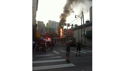 A fire burns on the corner of Oakland and Forbes avenues in Oakland.