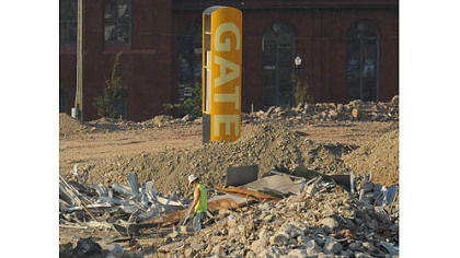 Signage for a gate of the Civic Arena stands alone during demolition operations.