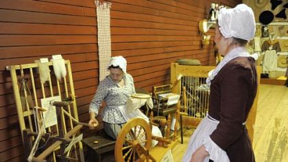 Sarah Carroll of Hampton, left, and Karen Parsons of Richland staff the Mercantile Center and demonstrate what parts of daily life would have consisted of in the18th century.