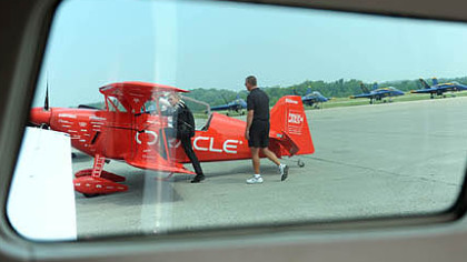 Pilots Sean D. Tucker, left, boards the Oracle Challenger 3 before a practice flight Thursday in preparation for this weekend's air show at the Westmoreland County Airport.