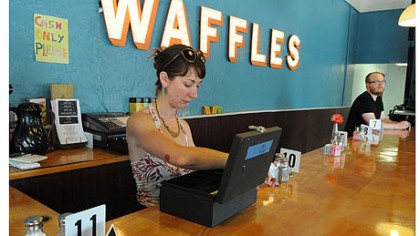 Courtney Ehrlichman gets ready behind the counter of the Waffle Shop in East Liberty.