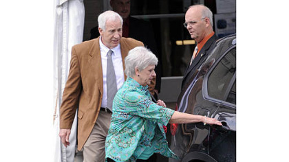 Jerry Sandusky and his wife, Dottie, leave the Centre County Courthouse after the jury deliberating his case heard testimony from witness Mike McQueary read to them in open court at their request Friday morning.