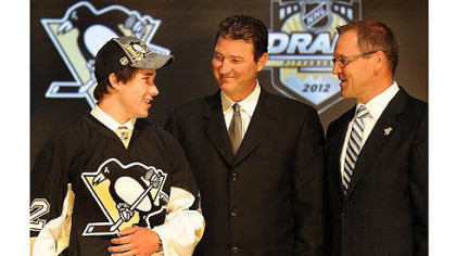 The Penguins pick Derrick Pouliot as their first round draft pick in the 2012 NHL Draft at the Consol Energy Center tonight in the Jordan Staal trade. At right, Penguins owner Mario Lemieux  and coach Dan Bylsma.