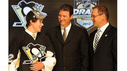 The Penguins pick Derrick Pouliot as their first round draft pick in the 2012 NHL Draft at the Consol Energy Center tonight in the Jordan Staal trade. At right, Penguins owner Mario Lemieux  and coach Dan Bylsma.
