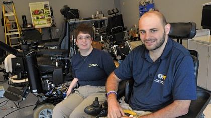 Elaine Houston and Jonathan Duvall in the lab with Ms. Houston's wheelchair project at the University of Pittsburgh. Mr. Duvall is working on his master's degree in rehabilitation engineer-ing and wants to pursue a doctorate. Ms. Houston is working on a doctorate in the field.