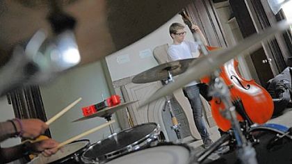 Sam Harris, 18, of Point Breeze plays bass during a jazz band rehearsal at the Center of Life in Hazelwood this month.