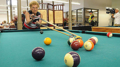 Phyllis Haduch of Mount Washington lines up her shot while playing pool at the historic South Side Market House today.