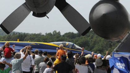 The crowd waves as one of the pilots of the U.S. Navy's Blue Angels taxis for takeoff Sunday at the Westmoreland County Air Show at Arnold Palmer Regional Airport near Latrobe.