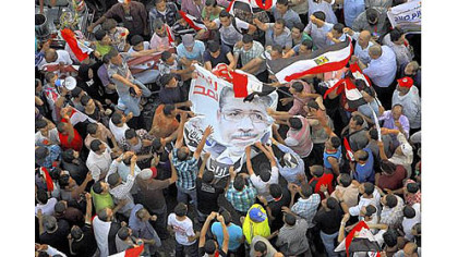 Egyptians celebrate the victory of Mohammed Morsi in the country's presidential election on Sunday in Cairo's Tahrir Square.