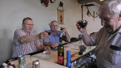 From left, Steve Gergery of Cheswick, Janos Kerekgyarto of Hazelwood and Frank Petohazi of Munhall toast on Friday with Hungarian wine on the last day of the Hungarian club in Hazelwood.