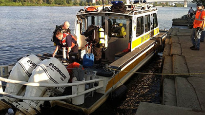 City of Pitsburgh river rescue personnel prepare to remove a van from the Ohio River near SCI Pittsburgh.