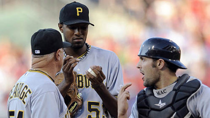 Pirates pitcher James McDonald talks to Ray Searage and catcher Michael McKenry after the Phillies' Carlos Ruiz hit a home run in the first inning.