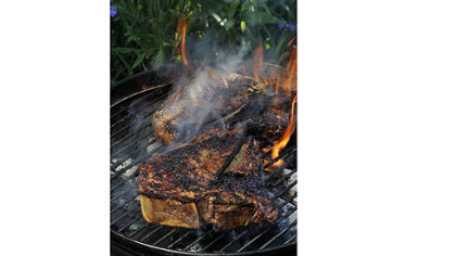 T-bone steaks on the grill.