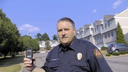 Chief Gary Hamilton of the North Fayette Volunteer Fire Department stands on Estate Drive in The Hawthorne, a townhouse community that has radio dead zones -- areas where the radio signals that firefighters use to communicate often are garbled, broken or dropped. The problem can have dire consequences. "It could be the difference between life and death," Chief Hamilton said.