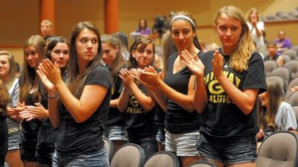 Gateway Middle School students applaud the school board's recommendation to keep the sports program in the middle school Wednesday night in Monroeville.