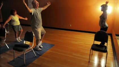 Connie Tinsley, right, teaches Grief Support Through Yoga to four students, including Kathy and Regis Ryan of Swissvale.