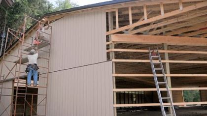 Roland Prior and Jim Barnett work on the new indoor arena for Riding for the Handicapped of Western Pennsylvania on Grubbs Road in McCandless.